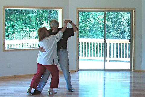 Susan and Eric dancing in their “Tango Palace”